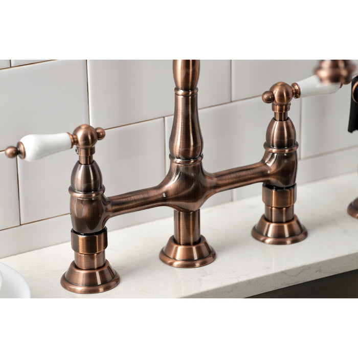 Kingston Heirloom KS127PLBSAC - Heritage Two-Handle 4-Hole Deck Mount Bridge Kitchen Faucet with Brass Sprayer, Antique Copper