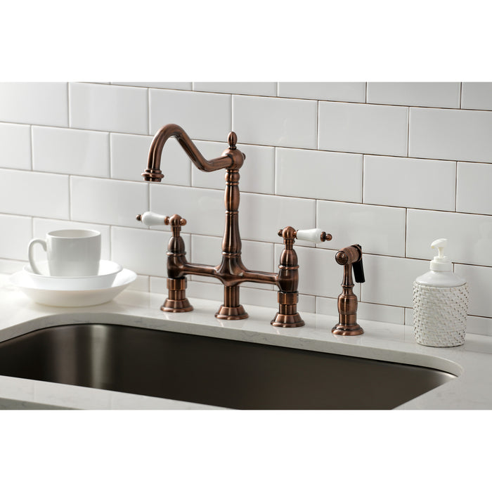 Kingston Heirloom KS127PLBSAC - Heritage Two-Handle 4-Hole Deck Mount Bridge Kitchen Faucet with Brass Sprayer, Antique Copper