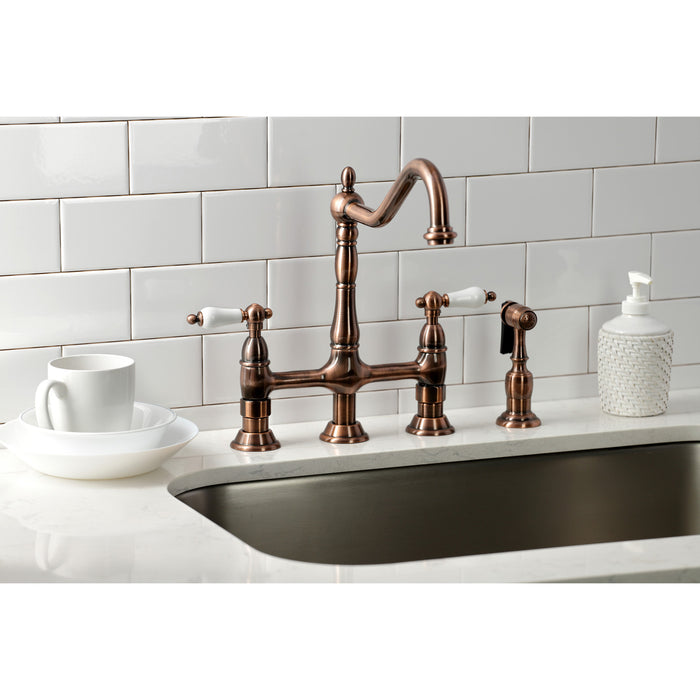 Kingston Heirloom KS127PLBSAC - Heritage Two-Handle 4-Hole Deck Mount Bridge Kitchen Faucet with Brass Sprayer, Antique Copper