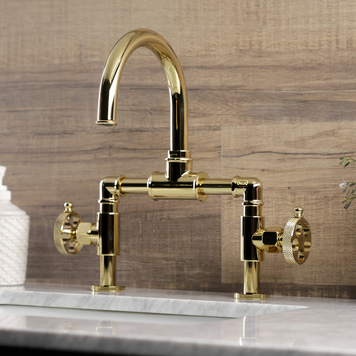Kingston Sona KS2172RKX - Webb Two-Handle 2-Hole Deck Mount Bridge Bathroom Faucet with Knurled Handle and Push Pop-Up Drain, Polished Brass