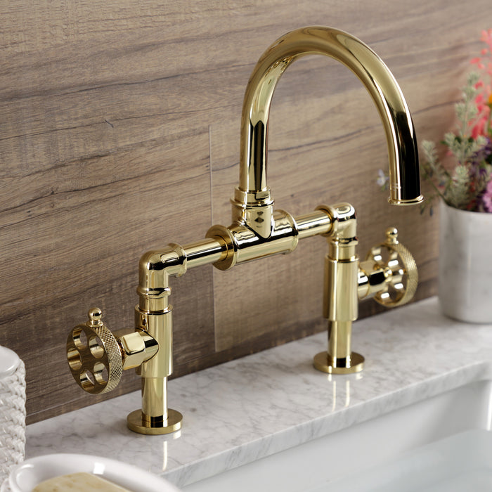 Kingston Sona KS2172RKX - Webb Two-Handle 2-Hole Deck Mount Bridge Bathroom Faucet with Knurled Handle and Push Pop-Up Drain, Polished Brass