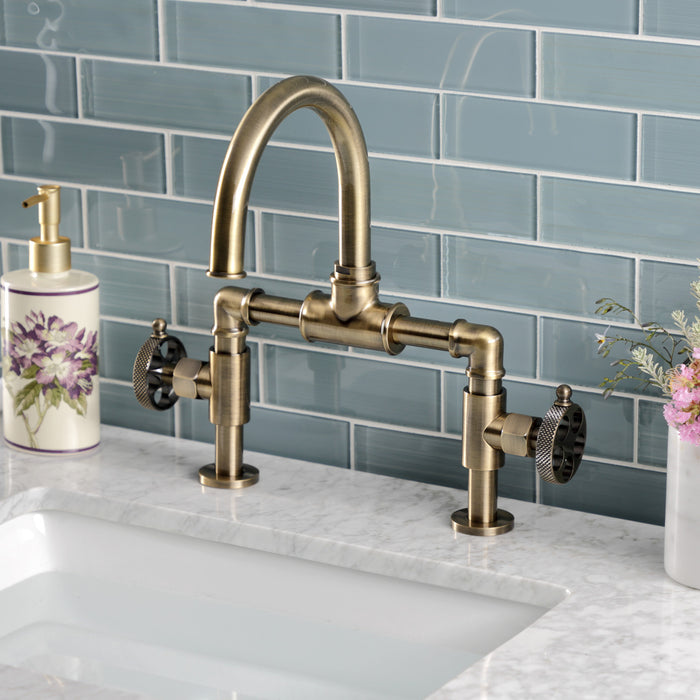 Kingston Sona KS2173RKX - Webb Two-Handle 2-Hole Deck Mount Bridge Bathroom Faucet with Knurled Handle and Push Pop-Up Drain, Antique Brass