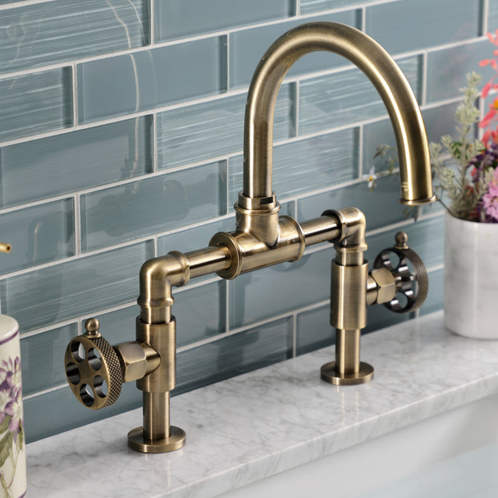 Kingston Sona KS2173RKX - Webb Two-Handle 2-Hole Deck Mount Bridge Bathroom Faucet with Knurled Handle and Push Pop-Up Drain, Antique Brass