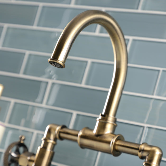 Kingston Sona KS2173RKX - Webb Two-Handle 2-Hole Deck Mount Bridge Bathroom Faucet with Knurled Handle and Push Pop-Up Drain, Antique Brass