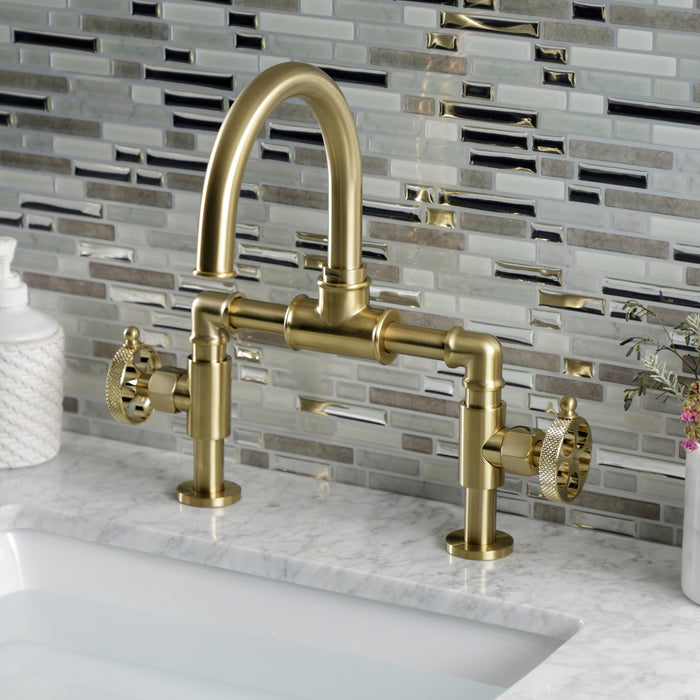 Kingston Sona KS2177RKX - Webb Two-Handle 2-Hole Deck Mount Bridge Bathroom Faucet with Knurled Handle and Push Pop-Up Drain, Brushed Brass