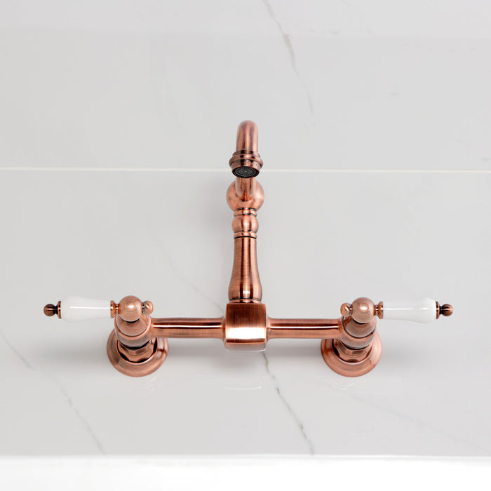 Kingston Heirloom KS244PLAC - Heritage Two-Handle 2-Hole Wall Mount Bridge Kitchen Faucet, Antique Copper