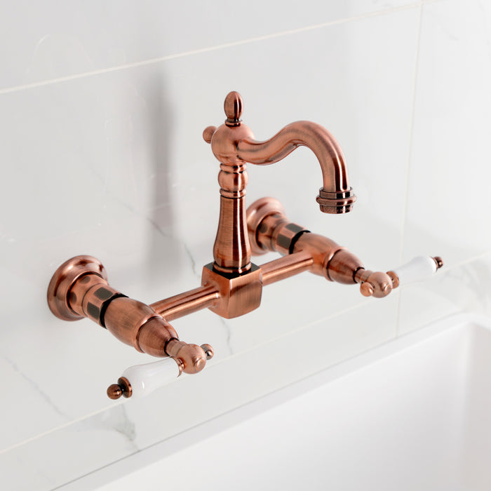 Kingston Heirloom KS244PLAC - Heritage Two-Handle 2-Hole Wall Mount Bridge Kitchen Faucet, Antique Copper