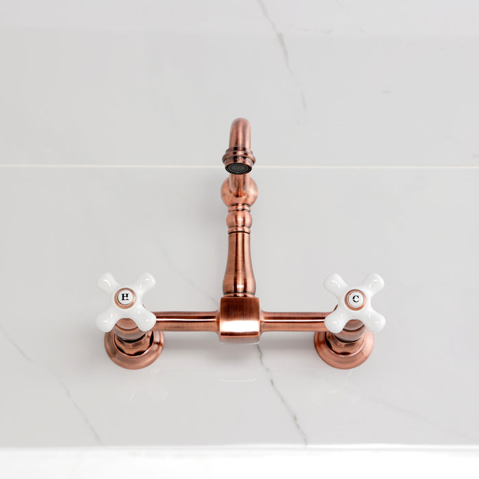 Kingston Heirloom KS244PXAC - Heritage Two-Handle 2-Hole Wall Mount Bridge Kitchen Faucet, Antique Copper