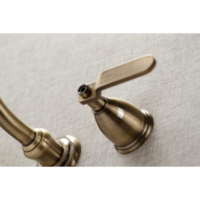 Kingston Heirloom KS3123KL - Whitaker Double-Handle 3-Hole Wall Mount Bathroom Faucet, Antique Brass