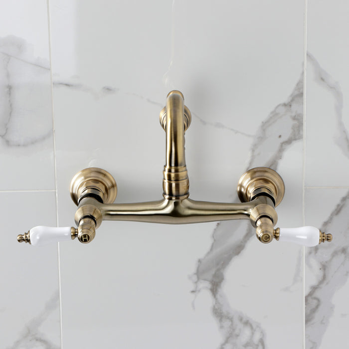 Kingston Heirloom KS3243PL - Vintage Double-Handle 2-Hole Wall Mount Bathroom Faucet, Antique Brass