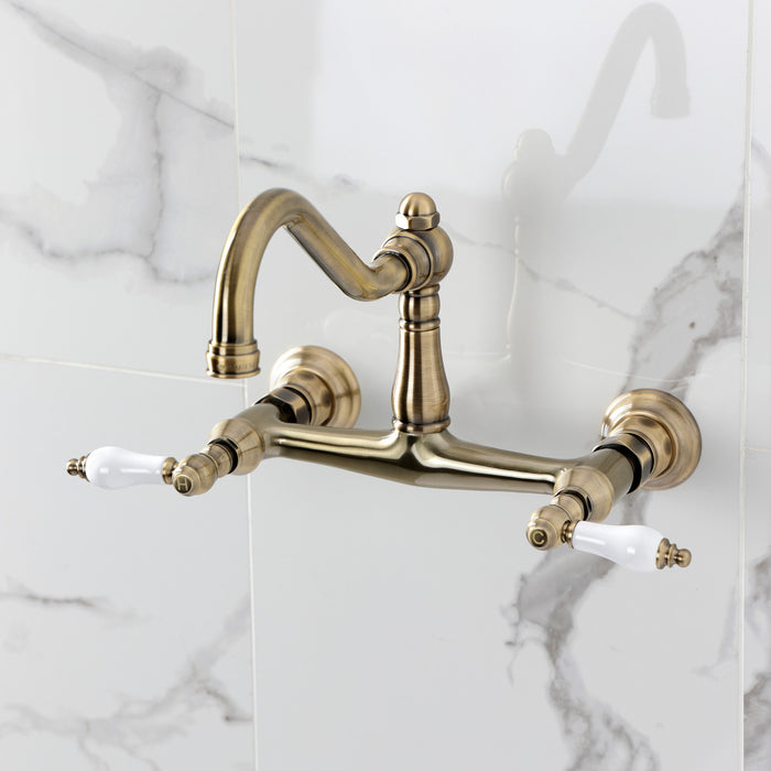 Kingston Heirloom KS3243PL - Vintage Double-Handle 2-Hole Wall Mount Bathroom Faucet, Antique Brass