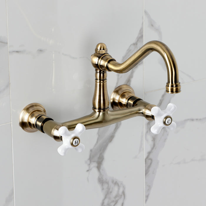 Kingston Heirloom KS3243PX - Vintage Double-Handle 2-Hole Wall Mount Bathroom Faucet, Antique Brass