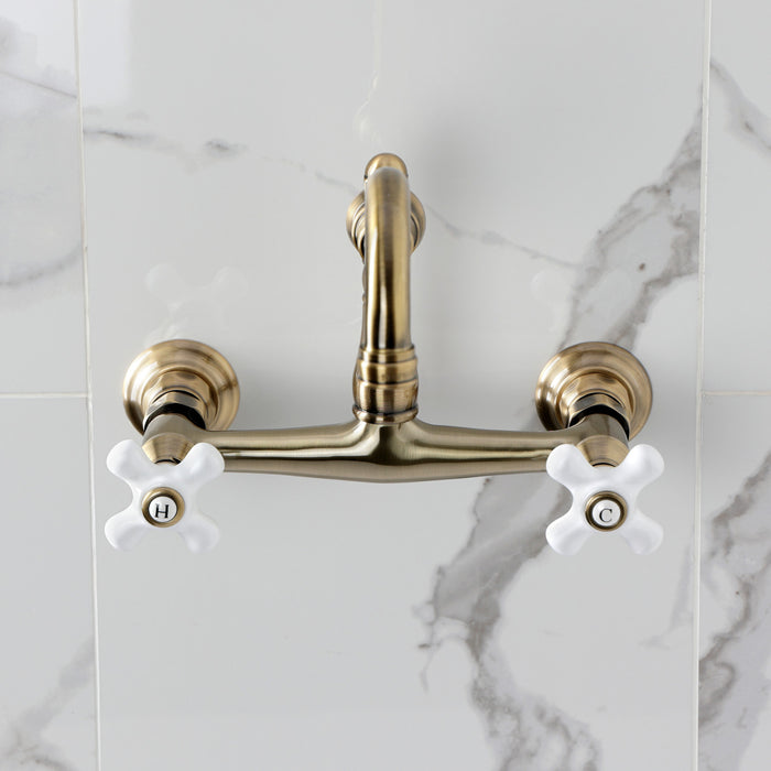 Kingston Heirloom KS3243PX - Vintage Double-Handle 2-Hole Wall Mount Bathroom Faucet, Antique Brass