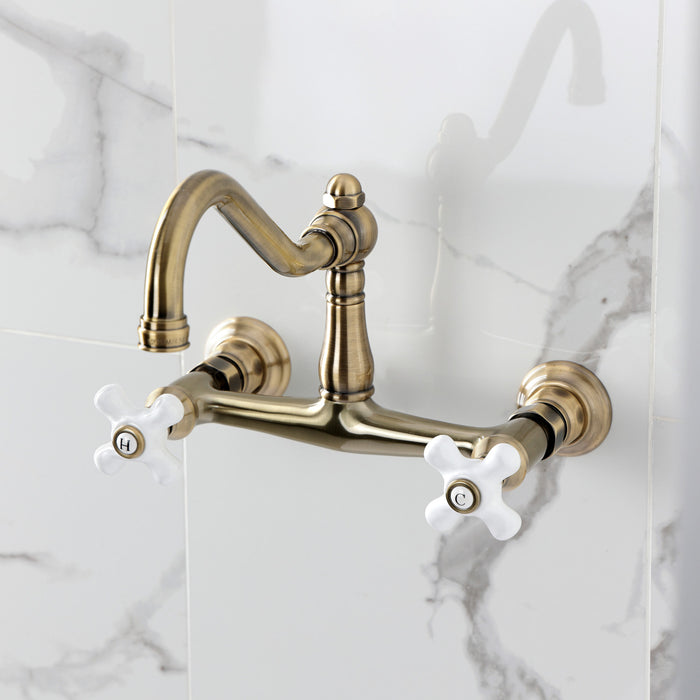 Kingston Heirloom KS3243PX - Vintage Double-Handle 2-Hole Wall Mount Bathroom Faucet, Antique Brass