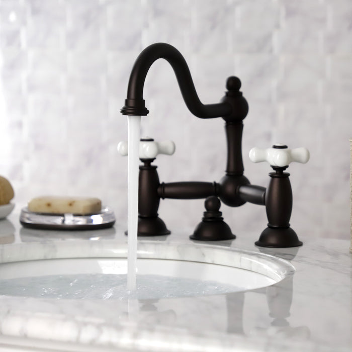 Kingston Heirloom KS3915PX - Restoration Two-Handle 3-Hole Deck Mount Bridge Bathroom Faucet with Brass Pop-Up, Oil Rubbed Bronze