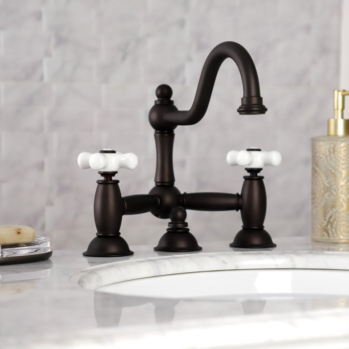 Kingston Heirloom KS3915PX - Restoration Two-Handle 3-Hole Deck Mount Bridge Bathroom Faucet with Brass Pop-Up, Oil Rubbed Bronze