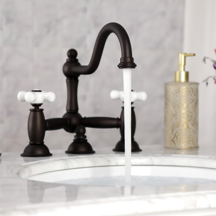 Kingston Heirloom KS3915PX - Restoration Two-Handle 3-Hole Deck Mount Bridge Bathroom Faucet with Brass Pop-Up, Oil Rubbed Bronze