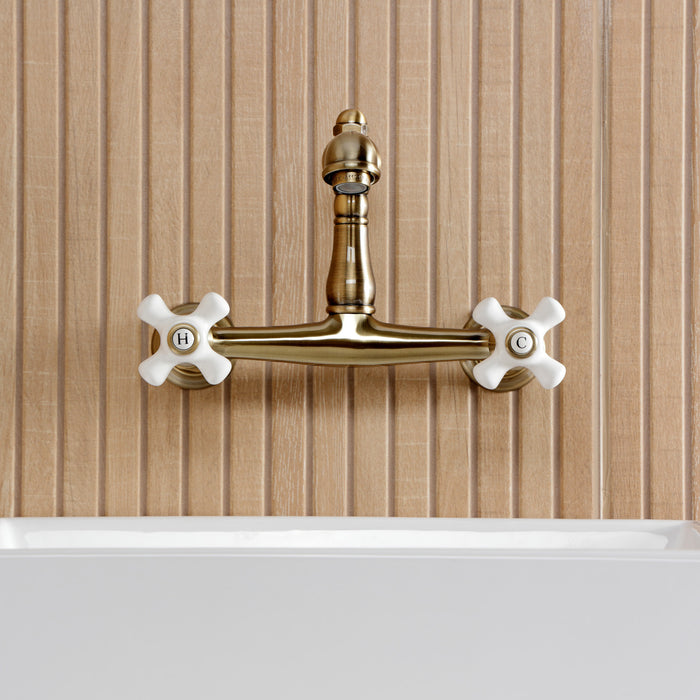 Kingston Heirloom KS7253PX - English Country Double-Handle 2-Hole Wall Mount Bathroom Faucet, Antique Brass