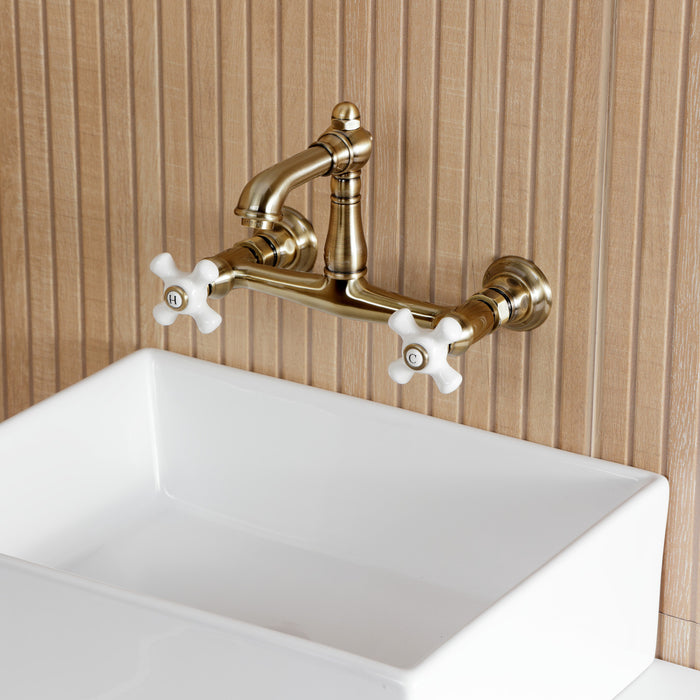 Kingston Heirloom KS7253PX - English Country Double-Handle 2-Hole Wall Mount Bathroom Faucet, Antique Brass