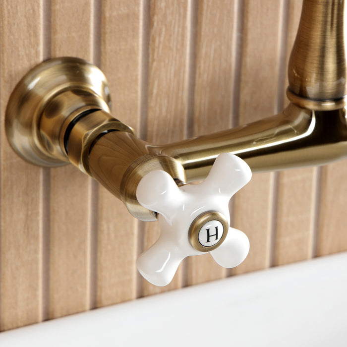 Kingston Heirloom KS7253PX - English Country Double-Handle 2-Hole Wall Mount Bathroom Faucet, Antique Brass