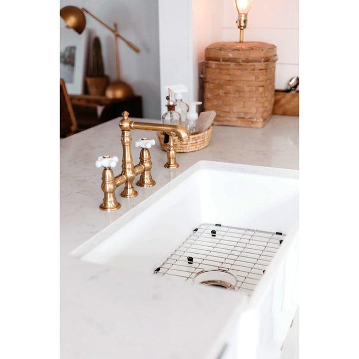 Kingston Tulare KS7277PXBS - English Country Two-Handle 4-Hole Deck Mount Bridge Kitchen Faucet with Brass Sprayer, Brushed Brass