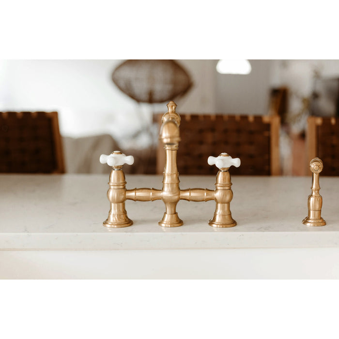 Kingston Tulare KS7277PXBS - English Country Two-Handle 4-Hole Deck Mount Bridge Kitchen Faucet with Brass Sprayer, Brushed Brass