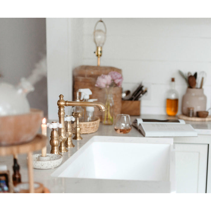 Kingston Tulare KS7277PXBS - English Country Two-Handle 4-Hole Deck Mount Bridge Kitchen Faucet with Brass Sprayer, Brushed Brass