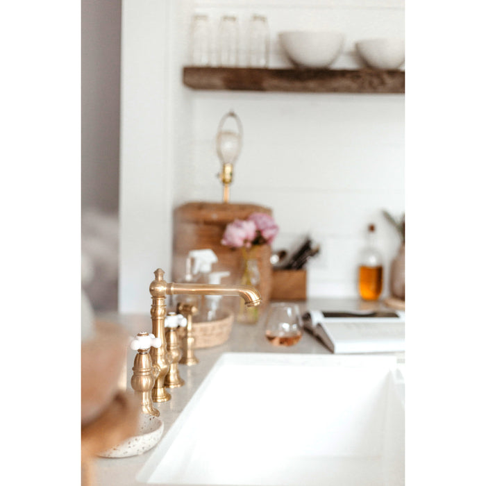 Kingston Tulare KS7277PXBS - English Country Two-Handle 4-Hole Deck Mount Bridge Kitchen Faucet with Brass Sprayer, Brushed Brass