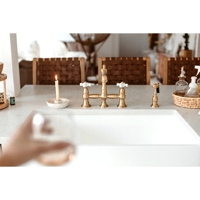 Kingston Tulare KS7277PXBS - English Country Two-Handle 4-Hole Deck Mount Bridge Kitchen Faucet with Brass Sprayer, Brushed Brass