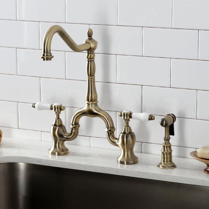 Kingston Heirloom KS7753BPLBS - Bel-Air Two-Handle 3-Hole Deck Mount Bridge Kitchen Faucet with Brass Sprayer, Antique Brass