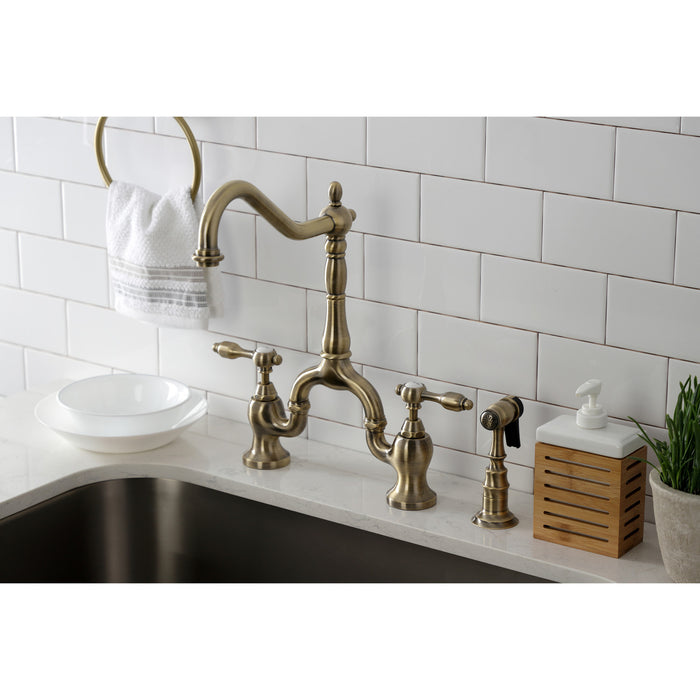 Kingston Heirloom KS7753TALBS - Tudor Two-Handle 3-Hole Deck Mount Bridge Kitchen Faucet with Brass Sprayer, Antique Brass