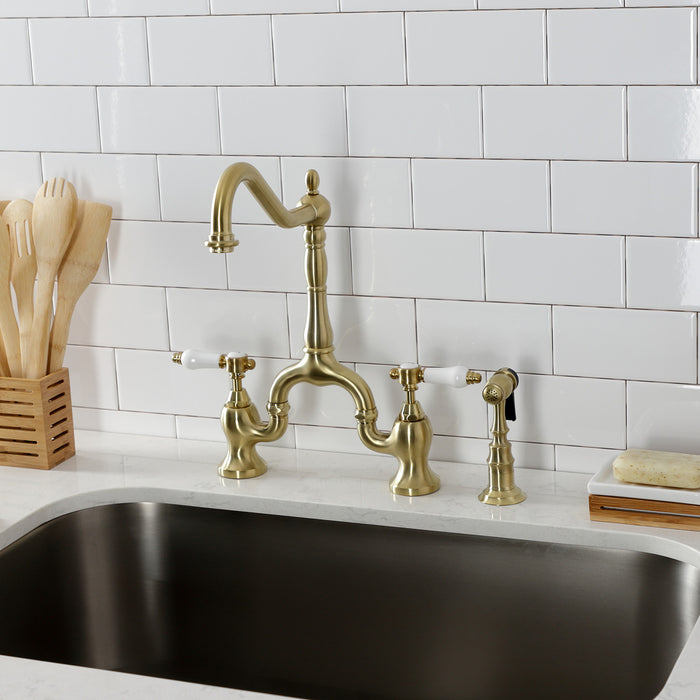 Kingston Heirloom KS7757BPLBS - Bel-Air Two-Handle 3-Hole Deck Mount Bridge Kitchen Faucet with Brass Sprayer, Brushed Brass