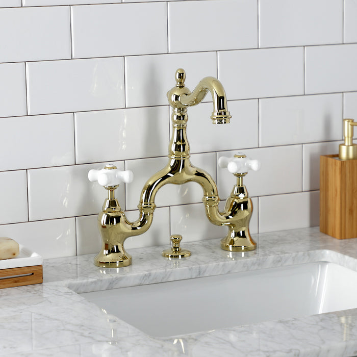 Kingston Heirloom KS7972PX - English Country Two-Handle 3-Hole Deck Mount Bridge Bathroom Faucet with Brass Pop-Up, Polished Brass