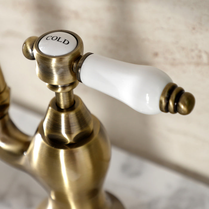 Kingston Heirloom KS7973BPL - Bel-Air Two-Handle 3-Hole Deck Mount Bridge Bathroom Faucet with Brass Pop-Up, Antique Brass