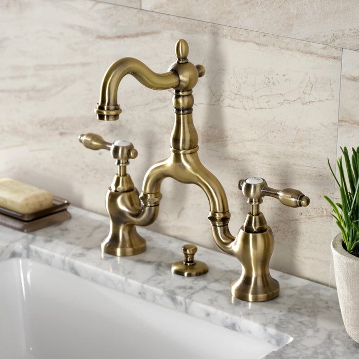 Kingston Heirloom KS7973TAL - Tudor Two-Handle 3-Hole Deck Mount Bridge Bathroom Faucet with Brass Pop-Up, Antique Brass