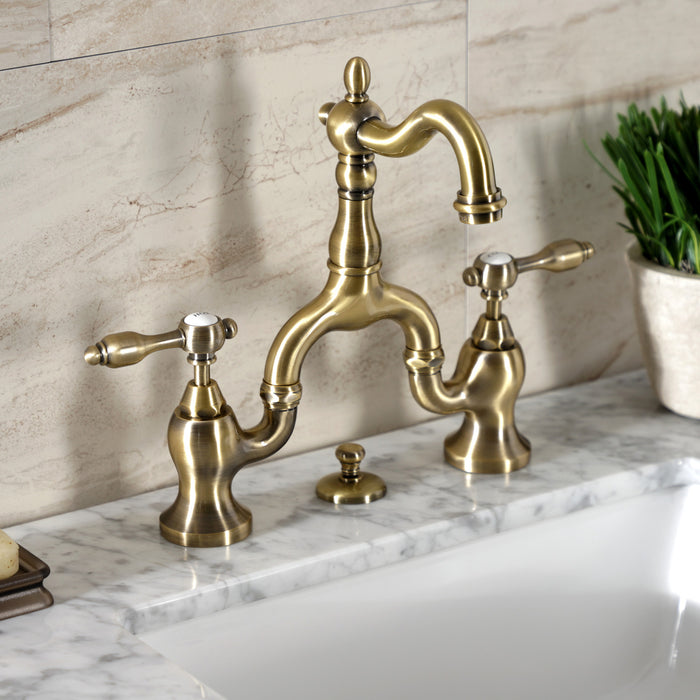 Kingston Heirloom KS7973TAL - Tudor Two-Handle 3-Hole Deck Mount Bridge Bathroom Faucet with Brass Pop-Up, Antique Brass