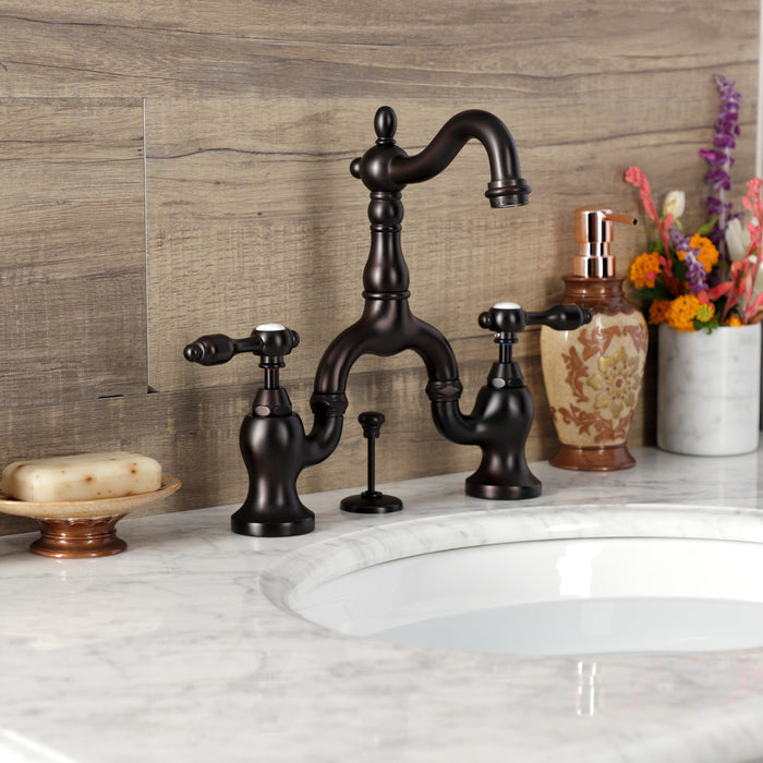 Tudor KS7975TAL Two-Handle 3-Hole Deck Mount Bridge Bathroom Faucet with Brass Pop-Up, Oil Rubbed Bronze