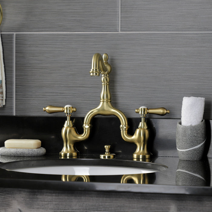 Kingston Heirloom KS7977BAL - Heirloom Two-Handle 3-Hole Deck Mount Bridge Bathroom Faucet with Brass Pop-Up, Brushed Brass