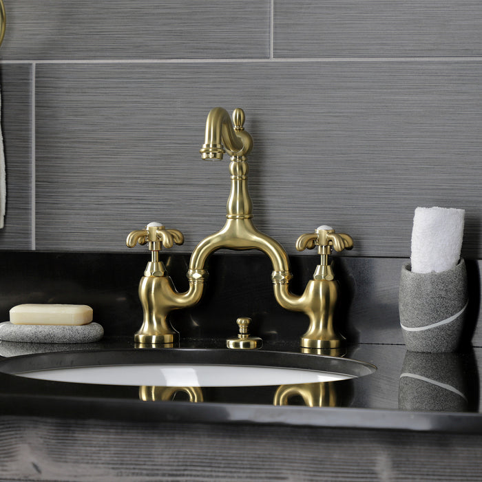 Kingston Heirloom KS7977TX - French Country Two-Handle 3-Hole Deck Mount Bridge Bathroom Faucet with Brass Pop-Up, Brushed Brass