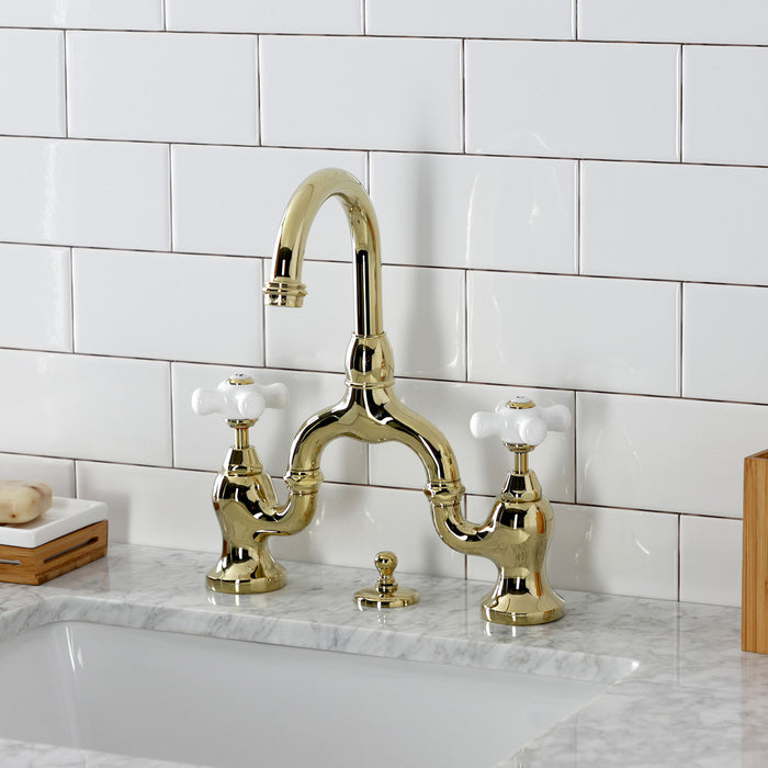 Kingston Heirloom KS7992PX - English Country Two-Handle 3-Hole Deck Mount Bridge Bathroom Faucet with Brass Pop-Up, Polished Brass