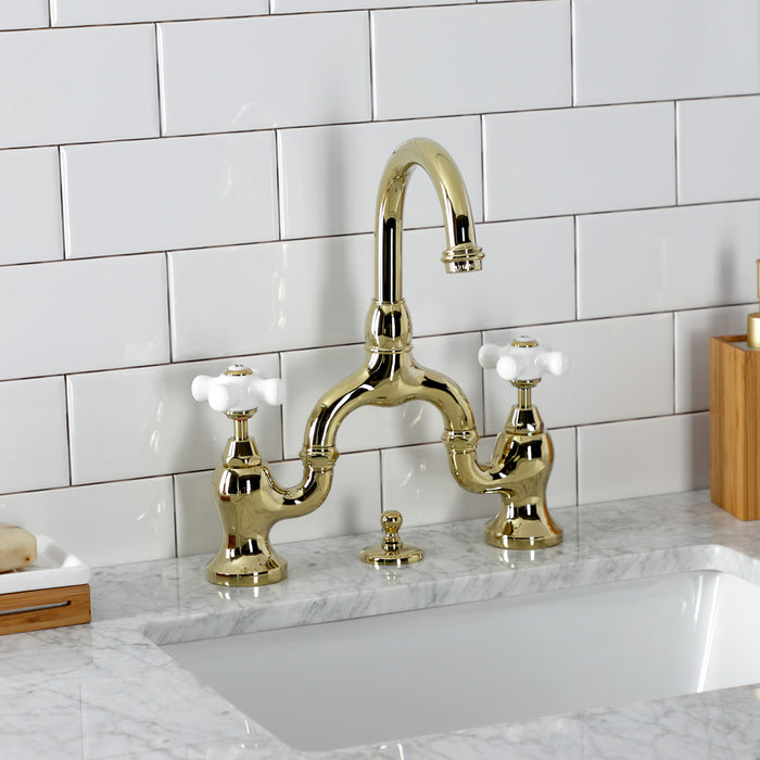 Kingston Heirloom KS7992PX - English Country Two-Handle 3-Hole Deck Mount Bridge Bathroom Faucet with Brass Pop-Up, Polished Brass