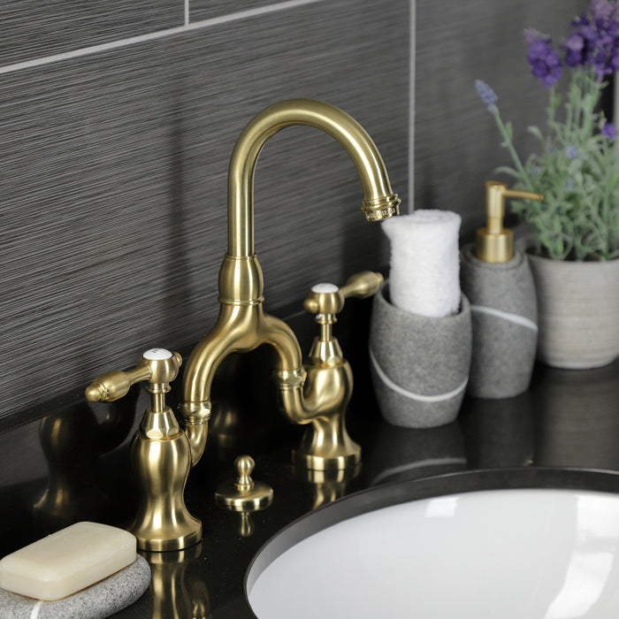 Kingston Heirloom KS7997TAL - Tudor Two-Handle 3-Hole Deck Mount Bridge Bathroom Faucet with Brass Pop-Up, Brushed Brass