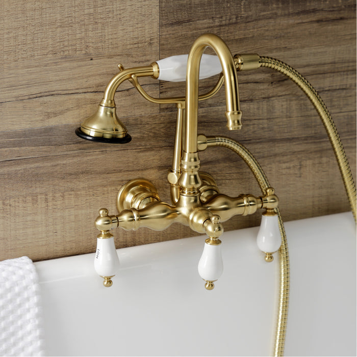 Kingston Heirloom AE9T7 - Aqua Vintage Three-Handle 2-Hole Tub Wall Mount Clawfoot Tub Faucet with Hand Shower, Brushed Brass