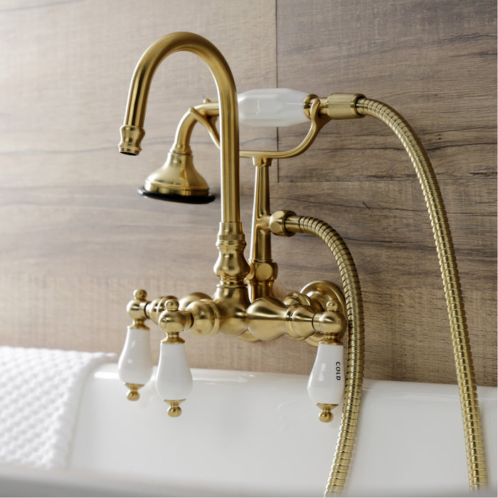 Kingston Heirloom AE9T7 - Aqua Vintage Three-Handle 2-Hole Tub Wall Mount Clawfoot Tub Faucet with Hand Shower, Brushed Brass