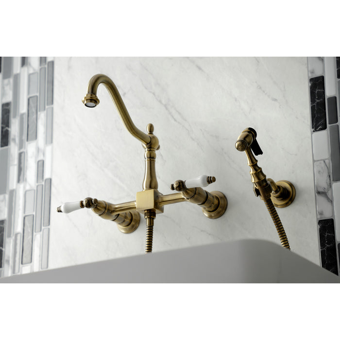 Heritage KS1243PLBS Two-Handle 2-Hole Wall Mount Bridge Kitchen Faucet with Brass Sprayer, Antique Brass