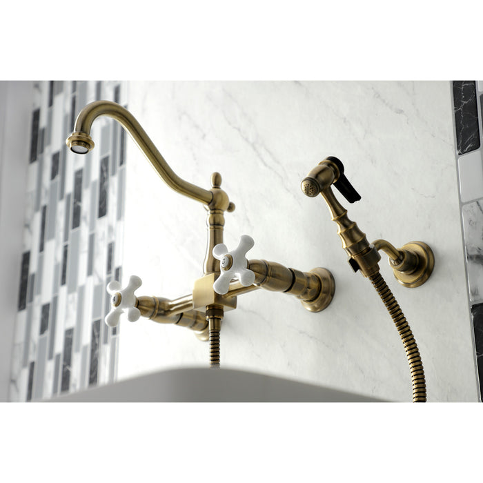 Heritage KS1243PXBS Two-Handle 2-Hole Wall Mount Bridge Kitchen Faucet with Brass Sprayer, Antique Brass