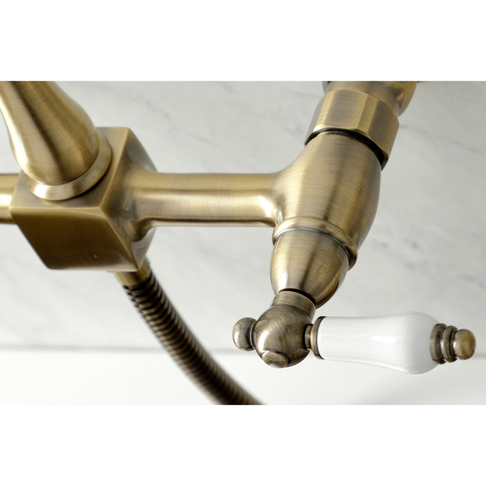 Heritage KS1263PLBS Two-Handle 2-Hole Wall Mount Bridge Kitchen Faucet with Brass Sprayer, Antique Brass