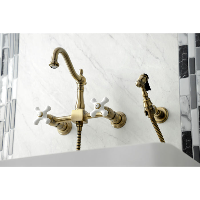 Heritage KS1263PXBS Two-Handle 2-Hole Wall Mount Bridge Kitchen Faucet with Brass Sprayer, Antique Brass