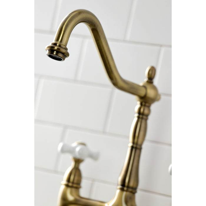 Kingston Heirloom KS1273PXBS - Heritage Two-Handle 4-Hole Deck Mount Bridge Kitchen Faucet with Brass Sprayer, Antique Brass