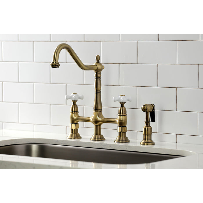 Kingston Heirloom KS1273PXBS - Heritage Two-Handle 4-Hole Deck Mount Bridge Kitchen Faucet with Brass Sprayer, Antique Brass